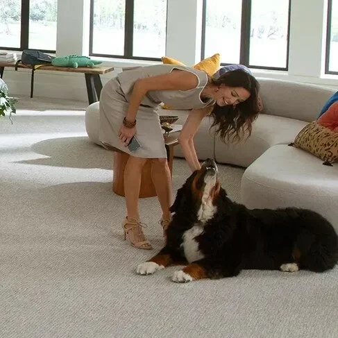 Our-Services Happy lady playing with dog | Titan Flooring